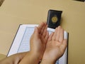 son's hands in mosque praying and reading holly book quran together islamic education concept