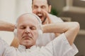 Son yelling at his father who is listening to music Royalty Free Stock Photo