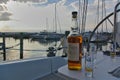 Sonderborg, Denmark - June 30th, 2012 - Bottle of Talisker single malt scotch whisky with glasses on the table in the cockpit of a