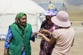Song Kul, Kyrgyzstan, August 8 2018: Three Kyrgyz women are discussing
