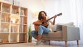 Song learning guitar playing woman musician home