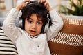This song makes me lose my cool. Portrait of an adorable little boy listening to music on headphones while sitting on a Royalty Free Stock Photo