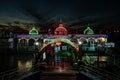 LED electric lighted riverboat in Harbin China against twilight sky