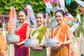 Songkran festival. Portrait Northern Thai people in Traditional clothes dressing handle handcrafted silver bowl in Songkran day