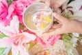 Songkran festival sign of Thailand : Hand of young people pour water, flowers on older. Thais celebrate Songkran in new year water Royalty Free Stock Photo