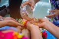 Songkran festival sign of Thailand : Hand of young people pour water, flowers on older. Thais celebrate Songkran in new year water Royalty Free Stock Photo