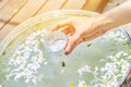 Water in bowl mixed with perfume and flowers corolla for Songkran festival in Thailand. Royalty Free Stock Photo