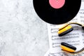 Songwriter or dj work place with vynil and headphones on stone background top view mockup
