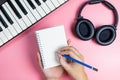 Songwriter is writing his new music on blank notebook Royalty Free Stock Photo