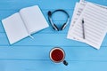 Songwriters workdesk with cup of tea. Royalty Free Stock Photo