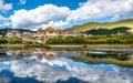 Songzanlin monastery panorama with lake and water reflection Shangri-La Yunnan China