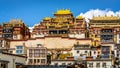 Songzanlin Tibetan Buddhist monastery close-up scenic colorful front view over clear blue sky in Shangri-La Yunnan China