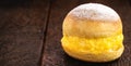 Sonho, sweet bread stuffed with cream, made with eggs, baumilia, sugar, milk and yeast. It is typical of Brazil, Portugal and Royalty Free Stock Photo