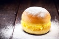 `Sonho`, sweet bread stuffed with cream, made with eggs, baumilia, sugar, milk and yeast. It is typical of Brazil, Portugal and Royalty Free Stock Photo
