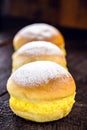 `Sonho`, sweet bread stuffed with cream, made with eggs, baumilia, sugar, milk and yeast. It is typical of Brazil, Portugal and Royalty Free Stock Photo