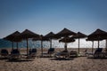 Sea beach, umbrella deck chair in Cadiz noon sunshine