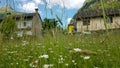 Sonogno, typical Ticino Village in Verzasca Valley, Switzerland with flower meadow. Royalty Free Stock Photo