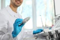 Sonographer holding ultrasound machine probe with gel in clinic, closeup Royalty Free Stock Photo