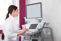 Sonographer using modern ultrasound machine Royalty Free Stock Photo