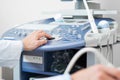 Sonographer using ultrasound machine at work. Royalty Free Stock Photo