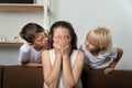 Sons comfort their upset mom. Children feel sorry for their crying mother