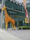 Giraffe made of childrens building bricks in the Sony Centre in Berlin