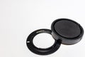 Sony lens adapter and cap on a white background. Copy space Royalty Free Stock Photo