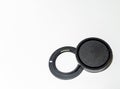 Sony lens adapter and cap on a white background. Copy space