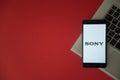 Sony logo on smartphone screen placed on laptop keyboard. Royalty Free Stock Photo