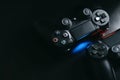 Sony Playstation 4 game joysticks on black background with copy space