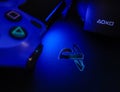 Sony Playstation logo illuminated on blue light from game controller Royalty Free Stock Photo