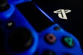 Sony Playstation logo illuminated on blue light from game controller