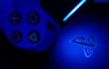 Sony Playstation logo illuminated on blue light from game controller