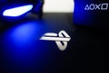 Sony Playstation logo illuminated on blue light from game controller