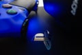 Sony Playstation logo illuminated on blue light from game controller Royalty Free Stock Photo