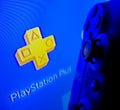 Sony Playstation Plus logo on screen and blue controller