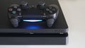 Sony PlayStation 4 Slim PS4 with DualShock 4 controller, Home video game console developed by Sony Interactive Entertainment Royalty Free Stock Photo