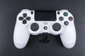 Sony PlayStation 4 Slim 1Tb revision and dualshock game controller. Game console with a joystick. Home video game console Royalty Free Stock Photo