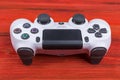 Sony PlayStation 4 Slim 1Tb revision and dualshock game controller. Game console with a joystick. Home video game console Royalty Free Stock Photo