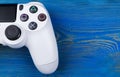 Sony PlayStation 4 Slim 1Tb revision and dualshock game controller. Game console with a joystick. Home video game console Royalty Free Stock Photo