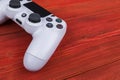 Sony PlayStation 4 Slim 1Tb revision and dualshock game controller. Game console with a joystick. Home video game console on wood Royalty Free Stock Photo