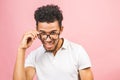 Soon to be startup owner or salesman. Portrait of cool and handsome african male student looking at camera smiling with eyeglasses Royalty Free Stock Photo