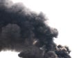 Soot. Black smoke. Royalty Free Stock Photo