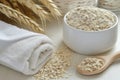 a soothing oatmeal bath preparation with colloidal oatmeal and a towel Royalty Free Stock Photo