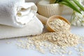 a soothing oatmeal bath preparation with colloidal oatmeal and a towel Royalty Free Stock Photo