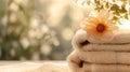 Soothing spa essentials, fluffy towels with flower. perfect for wellness and relaxation. soft focus and warm light. AI