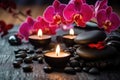 Spa Still Life with Orchids, Stones, and Candles Royalty Free Stock Photo