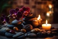 Spa Still Life with Orchids, Stones, and Candles Royalty Free Stock Photo