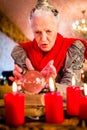 Soothsayer during esoteric session with Crystal ball Royalty Free Stock Photo