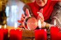 Soothsayer during esoteric session with Crystal ball Royalty Free Stock Photo